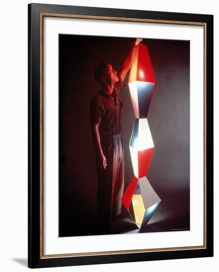 Japanese American Sculptor Isamu Noguchi Adjusting a Light Sculpture He Designed-Eliot Elisofon-Framed Premium Photographic Print