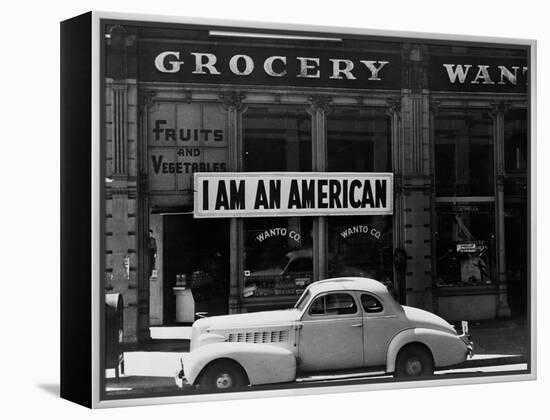 Japanese American shop owner in Oakland, CA hopes to avoid internment after Pearl Harbor, 1942-Dorothea Lange-Framed Premier Image Canvas