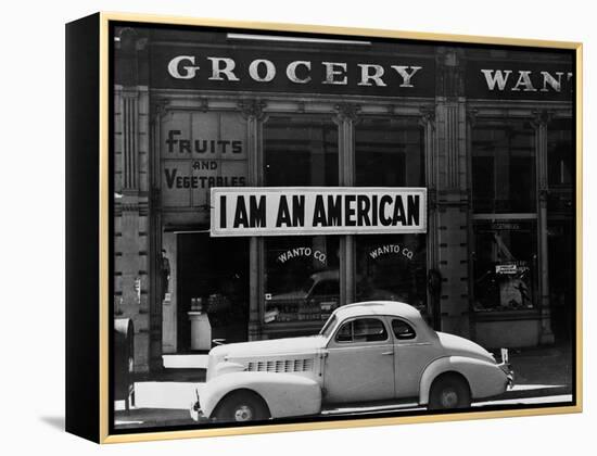 Japanese American shop owner in Oakland, CA hopes to avoid internment after Pearl Harbor, 1942-Dorothea Lange-Framed Premier Image Canvas