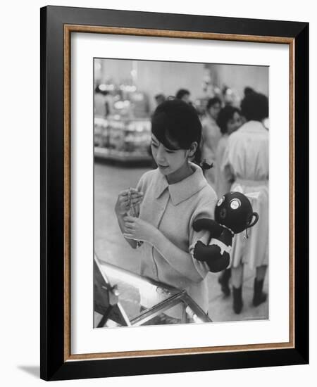 Japanese Girl with Dakkochan Doll on Her Arm-John Dominis-Framed Photographic Print