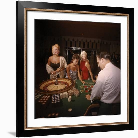 Jayne Mansfield, Rita Moreno, Gloria Paul Gambling at Dunes Casino. Las Vegas, 1955-Loomis Dean-Framed Premium Photographic Print