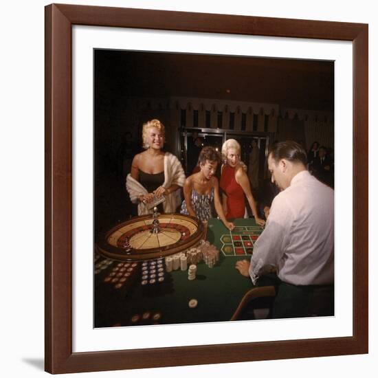 Jayne Mansfield, Rita Moreno, Gloria Paul Gambling at Dunes Casino. Las Vegas, 1955-Loomis Dean-Framed Premium Photographic Print