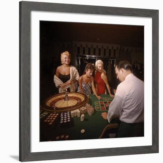 Jayne Mansfield, Rita Moreno, Gloria Paul Gambling at Dunes Casino. Las Vegas, 1955-Loomis Dean-Framed Premium Photographic Print