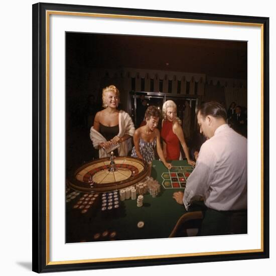 Jayne Mansfield, Rita Moreno, Gloria Paul Gambling at Dunes Casino. Las Vegas, 1955-Loomis Dean-Framed Premium Photographic Print