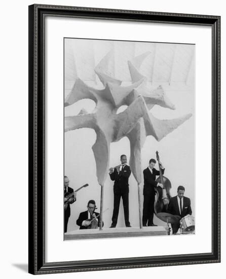 Jazz Drummer Chico Hamilton Playing with Band Behind Sculpture Called "Counterpoints"-Gordon Parks-Framed Premium Photographic Print