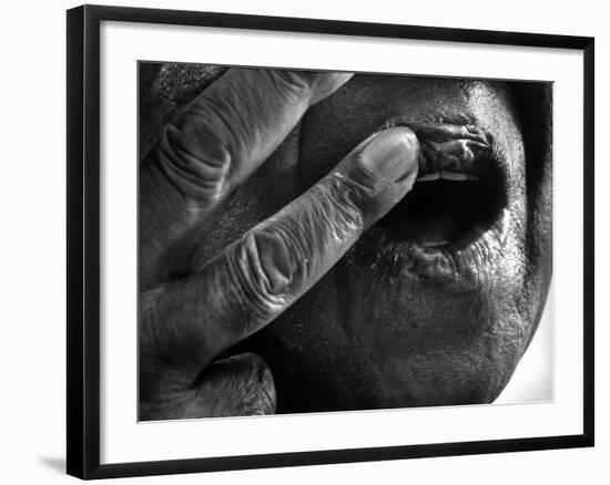 Jazz Trumpeter Louis Armstrong Massaging Lips with Balm to Keep Them Strong for Playing His Trumpet-John Loengard-Framed Premium Photographic Print