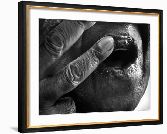 Jazz Trumpeter Louis Armstrong Massaging Lips with Balm to Keep Them Strong for Playing His Trumpet-John Loengard-Framed Premium Photographic Print