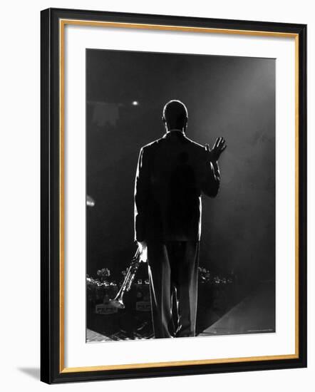 Jazz Trumpeter Louis Armstrong Waving to a Crowd of Adoring Fans as Their Applause Rolls over Him-John Loengard-Framed Premium Photographic Print