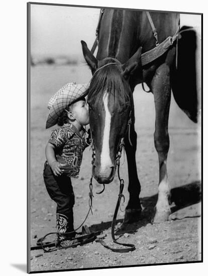 Jean Anne Evans, 14 Month Old Texas Girl Kissing Her Horse-Allan Grant-Mounted Photographic Print