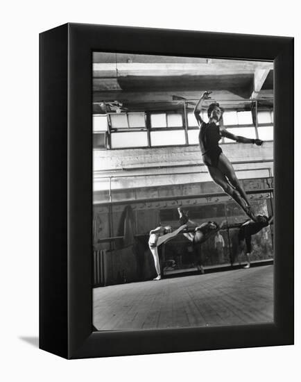 Jean Babilee, Star of Ballets Des Champs Elysees, Leaping During Practice as Other Dancers Watch-Gjon Mili-Framed Premier Image Canvas