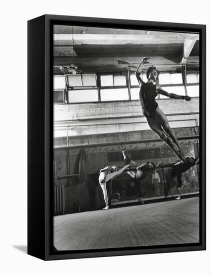 Jean Babilee, Star of Ballets Des Champs Elysees, Leaping During Practice as Other Dancers Watch-Gjon Mili-Framed Premier Image Canvas