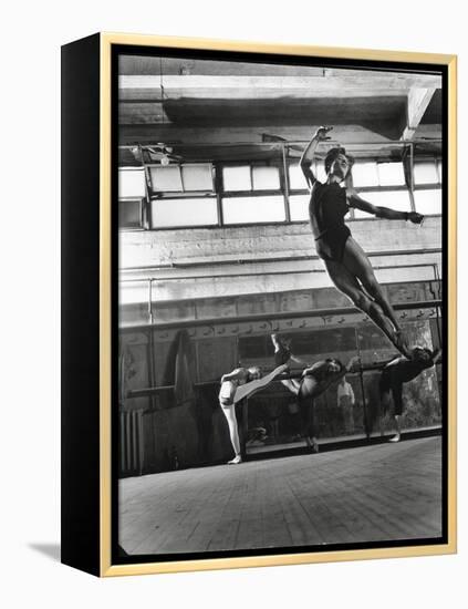 Jean Babilee, Star of Ballets Des Champs Elysees, Leaping During Practice as Other Dancers Watch-Gjon Mili-Framed Premier Image Canvas