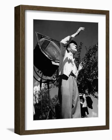 Jean Cocteau on the set of 'La Belle et La Bete', 1946 (b/w photo)-French Photographer-Framed Photo