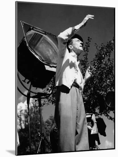 Jean Cocteau on the set of 'La Belle et La Bete', 1946 (b/w photo)-French Photographer-Mounted Photo