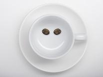 A Coffee Cup with Two Coffee Beans Making a Smiley Face-Jean Gillis-Photographic Print