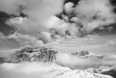 Clouds hang between the mountains of the Dolomites-Jean Schwarz-Laminated Photographic Print