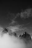 Clouds hang between the mountains of the Dolomites-Jean Schwarz-Framed Photographic Print