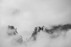 Clouds hang between the mountains of the Dolomites-Jean Schwarz-Photographic Print