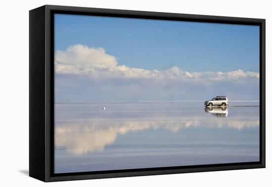 Jeep driving on the reflected surface of the salt flat, Salar de Uyuni, Potosi Department, Bolivia.-Keren Su-Framed Premier Image Canvas