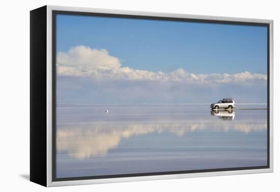 Jeep driving on the reflected surface of the salt flat, Salar de Uyuni, Potosi Department, Bolivia.-Keren Su-Framed Premier Image Canvas