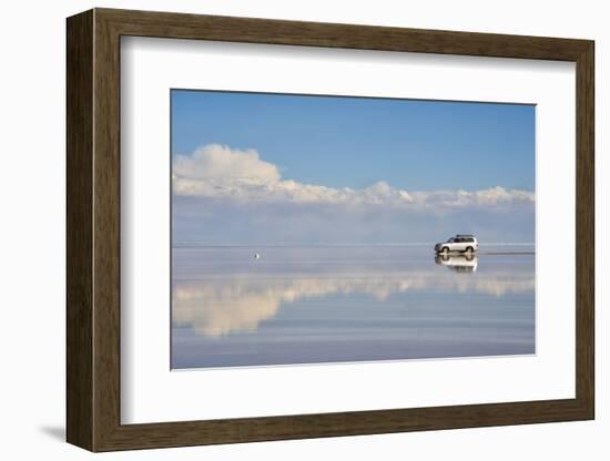 Jeep driving on the reflected surface of the salt flat, Salar de Uyuni, Potosi Department, Bolivia.-Keren Su-Framed Photographic Print