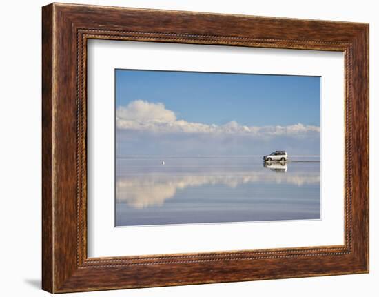 Jeep driving on the reflected surface of the salt flat, Salar de Uyuni, Potosi Department, Bolivia.-Keren Su-Framed Photographic Print