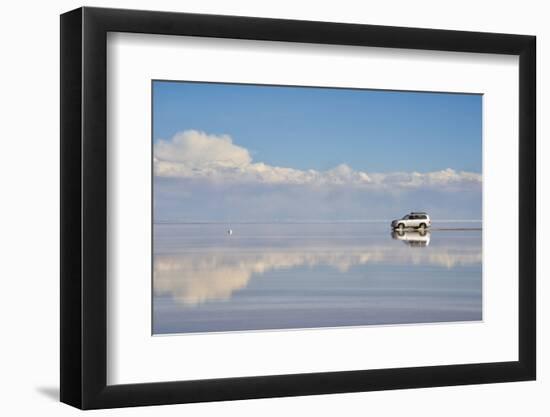 Jeep driving on the reflected surface of the salt flat, Salar de Uyuni, Potosi Department, Bolivia.-Keren Su-Framed Photographic Print