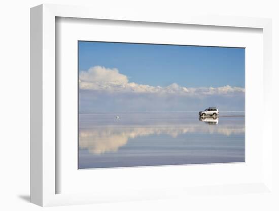 Jeep driving on the reflected surface of the salt flat, Salar de Uyuni, Potosi Department, Bolivia.-Keren Su-Framed Photographic Print