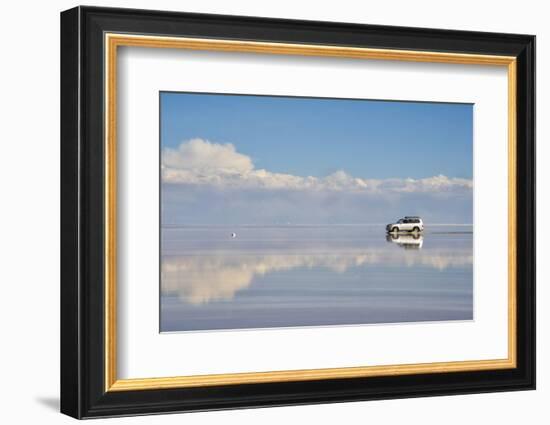 Jeep driving on the reflected surface of the salt flat, Salar de Uyuni, Potosi Department, Bolivia.-Keren Su-Framed Photographic Print