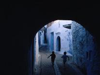 Two Boys Running Through Kasbah, Chefchaouen, Morocco-Jeffrey Becom-Photographic Print