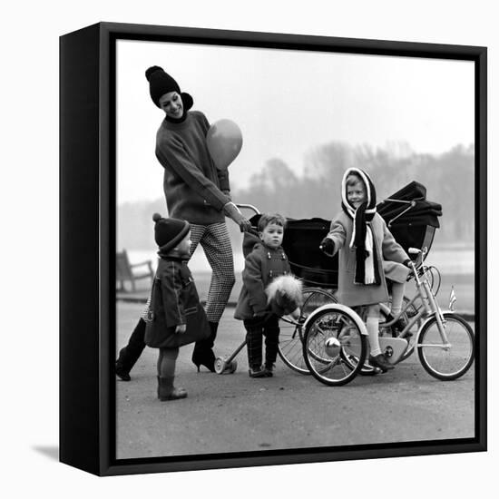 Jenny Boyd in Light Pants and Boots with Children, 1960s-John French-Framed Premier Image Canvas