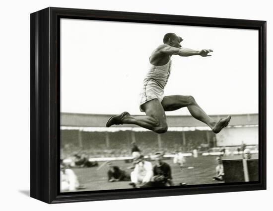 Jesse Owens in Action at the Long Jump During the Berlin Olympics, 1936-null-Framed Premier Image Canvas