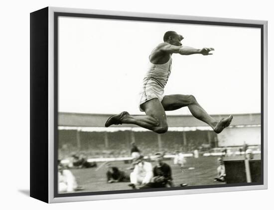 Jesse Owens in Action at the Long Jump During the Berlin Olympics, 1936-null-Framed Premier Image Canvas