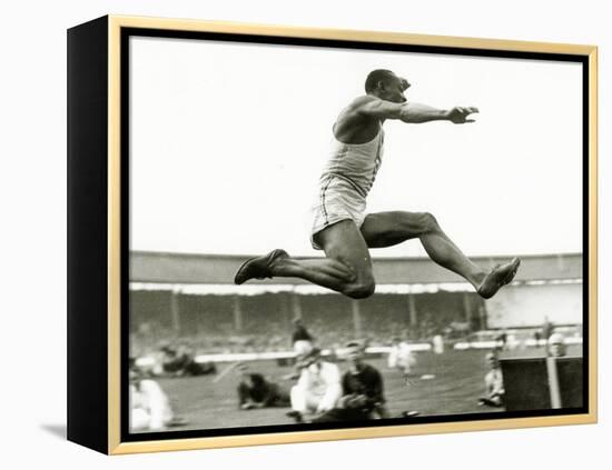 Jesse Owens in Action at the Long Jump During the Berlin Olympics, 1936-null-Framed Premier Image Canvas