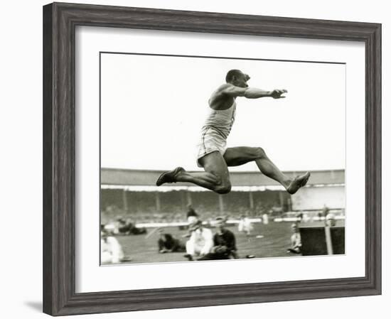 Jesse Owens in Action at the Long Jump During the Berlin Olympics, 1936-null-Framed Photographic Print