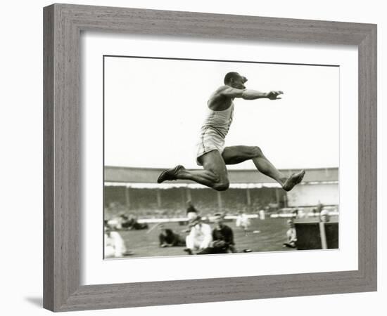 Jesse Owens in Action at the Long Jump During the Berlin Olympics, 1936-null-Framed Photographic Print