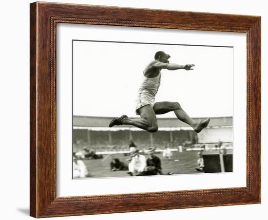 Jesse Owens in Action at the Long Jump During the Berlin Olympics, 1936-null-Framed Photographic Print