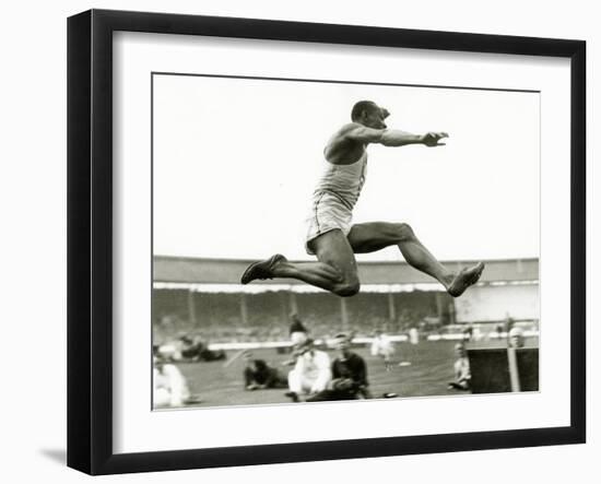 Jesse Owens in Action at the Long Jump During the Berlin Olympics, 1936-null-Framed Photographic Print