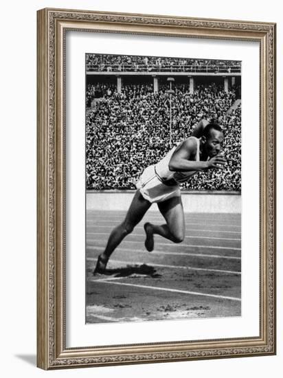 Jesse Owens Setting the 200 Meter Olympic Record at the Olympics in Berlin, Germany, 1936-null-Framed Art Print