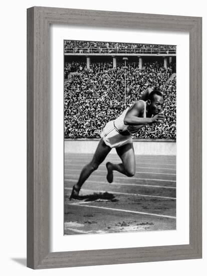 Jesse Owens Setting the 200 Meter Olympic Record at the Olympics in Berlin, Germany, 1936-null-Framed Art Print