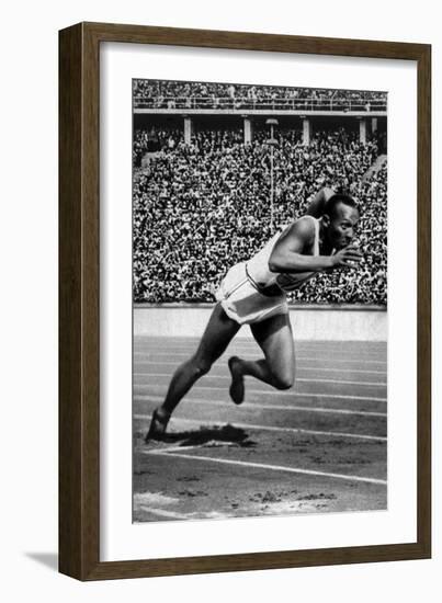 Jesse Owens Setting the 200 Meter Olympic Record at the Olympics in Berlin, Germany, 1936-null-Framed Art Print