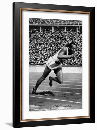 Jesse Owens Setting the 200 Meter Olympic Record at the Olympics in Berlin, Germany, 1936-null-Framed Art Print