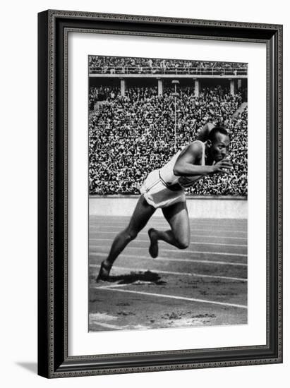 Jesse Owens Setting the 200 Meter Olympic Record at the Olympics in Berlin, Germany, 1936-null-Framed Art Print