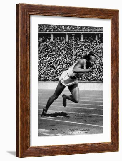 Jesse Owens Setting the 200 Meter Olympic Record at the Olympics in Berlin, Germany, 1936-null-Framed Premium Giclee Print