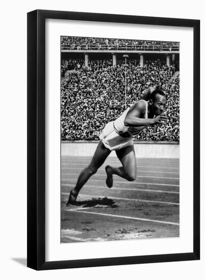 Jesse Owens Setting the 200 Meter Olympic Record at the Olympics in Berlin, Germany, 1936-null-Framed Premium Giclee Print