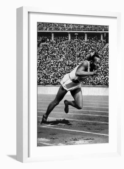 Jesse Owens Setting the 200 Meter Olympic Record at the Olympics in Berlin, Germany, 1936-null-Framed Premium Giclee Print