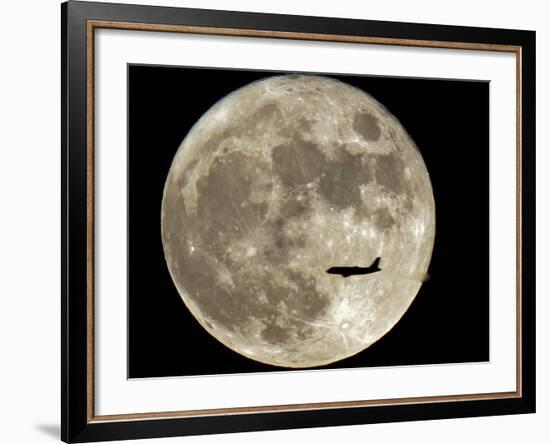 Jet is Silhouetted on the Full Moon in St. Petersburg, Russia-null-Framed Photographic Print