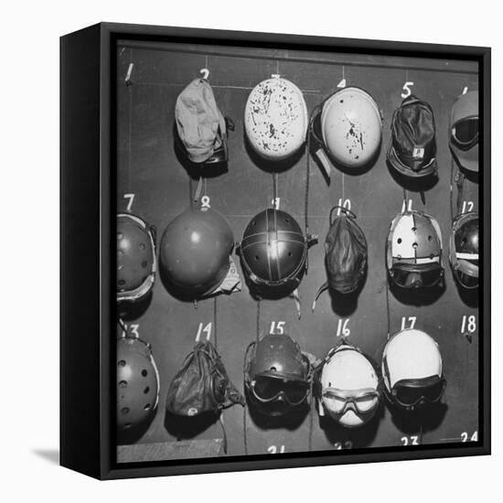 Jet Pilot Helmets and Goggles Hanging on Hooks-Charles E^ Steinheimer-Framed Premier Image Canvas