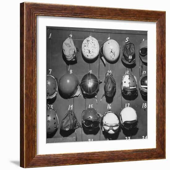 Jet Pilot Helmets and Goggles Hanging on Hooks-Charles E^ Steinheimer-Framed Photographic Print