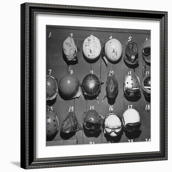 Jet Pilot Helmets and Goggles Hanging on Hooks-Charles E^ Steinheimer-Framed Photographic Print